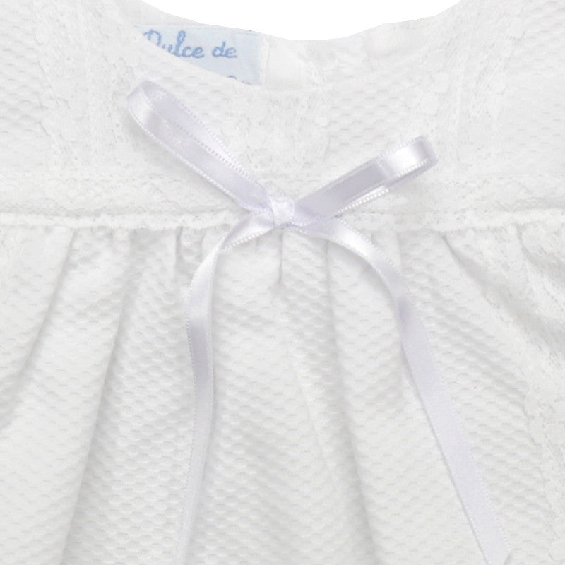 white piqué dress with tiny bow and lace